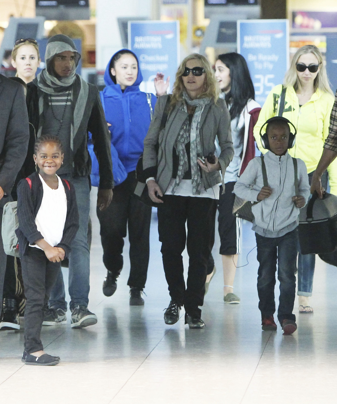 Madonna touches down in Heathrow after spending her 53rd birthday in New York with her boyfriend Brahim and her four children