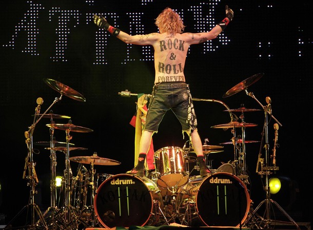 Musician James Kottak of the German band Scorpions shows his tattoo during their concert in La Paz