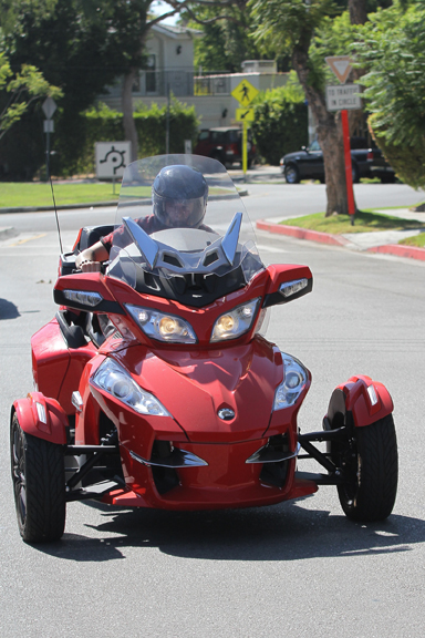 Justin Bieber switches out matte red Ferrari for a 3 wheeler ride around town