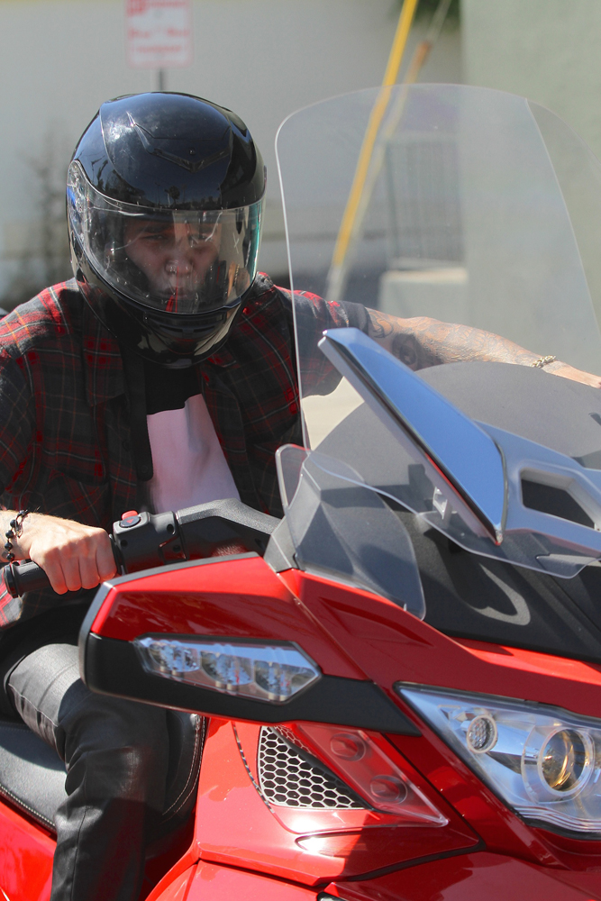 Justin Bieber switches out matte red Ferrari for a 3 wheeler ride around town