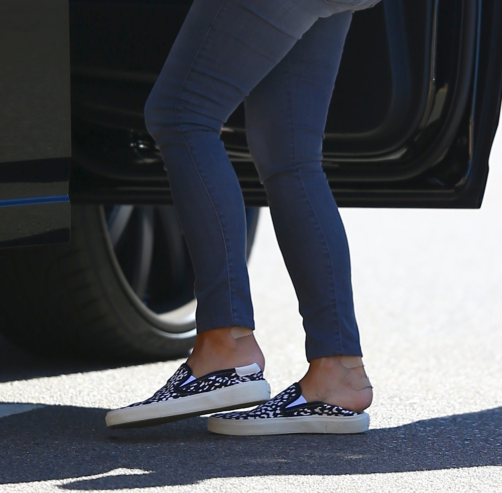 Kim Kardashian seen with band-aids on her heels as she leaves her hotel in La Jolla