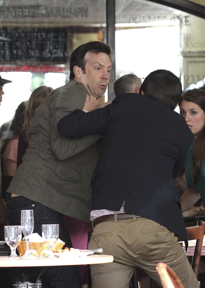 Jason Sudeikis and Adam Scott film a fighting scene at a restaurant for their upcoming movie "Sleeping with Other People" with co-star Amanda Peet in Manhattan, NYC
