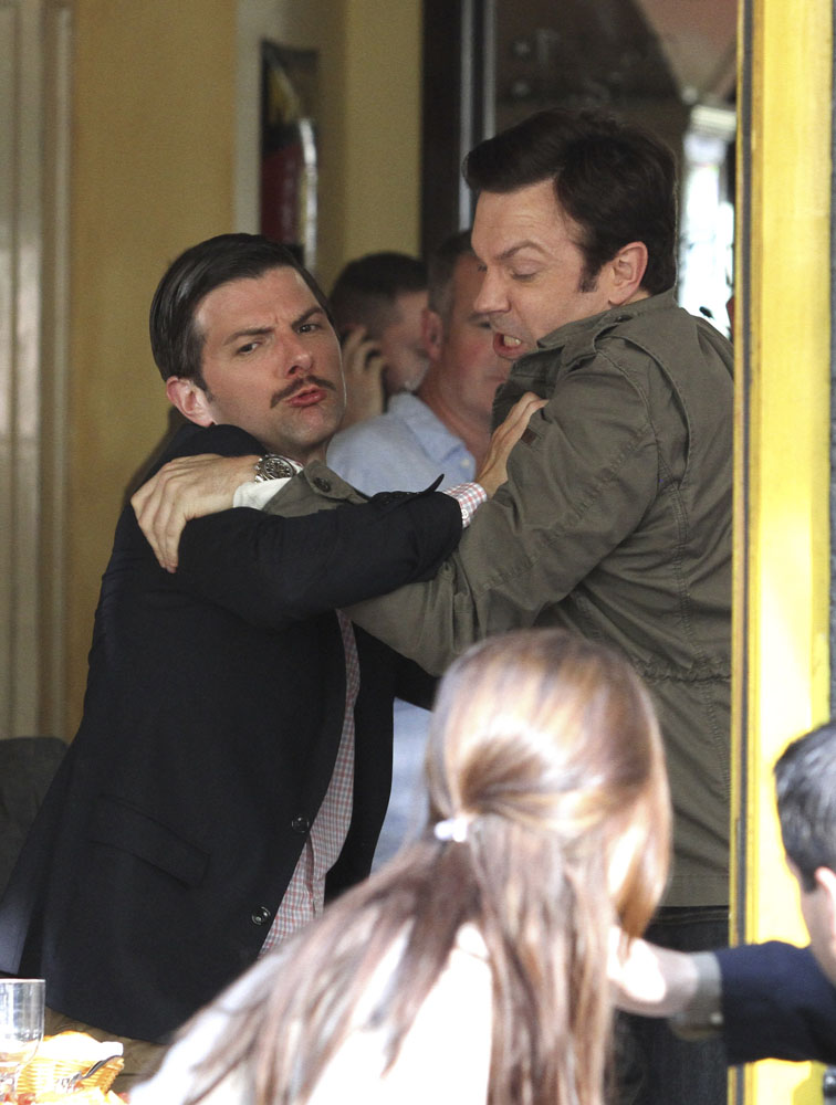 Jason Sudeikis and Adam Scott film a fighting scene at a restaurant for their upcoming movie "Sleeping with Other People" with co-star Amanda Peet in Manhattan, NYC