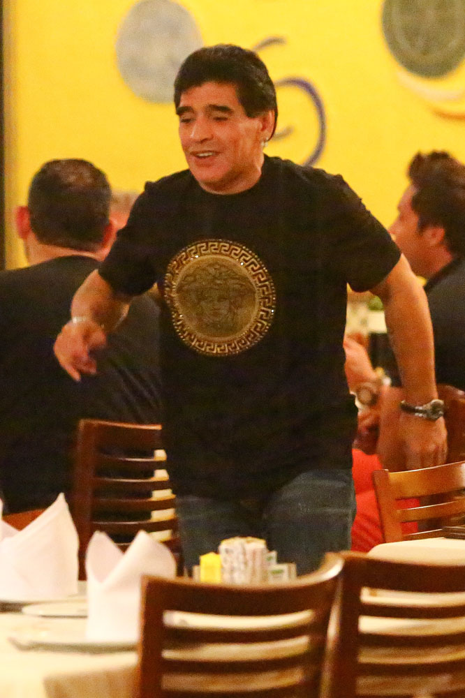 EXCLUSIVE: Legendary soccer star Diego Maradona enjoys dinner in Rio