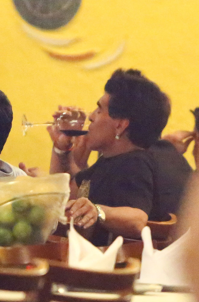 EXCLUSIVE: Legendary soccer star Diego Maradona enjoys dinner in Rio