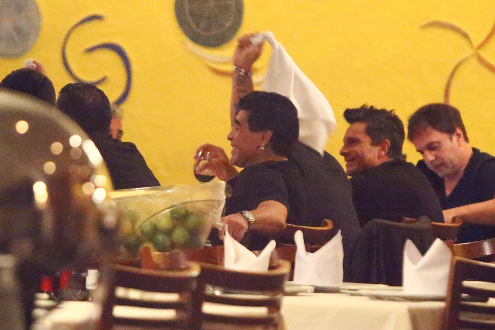 EXCLUSIVE: Legendary soccer star Diego Maradona enjoys dinner in Rio