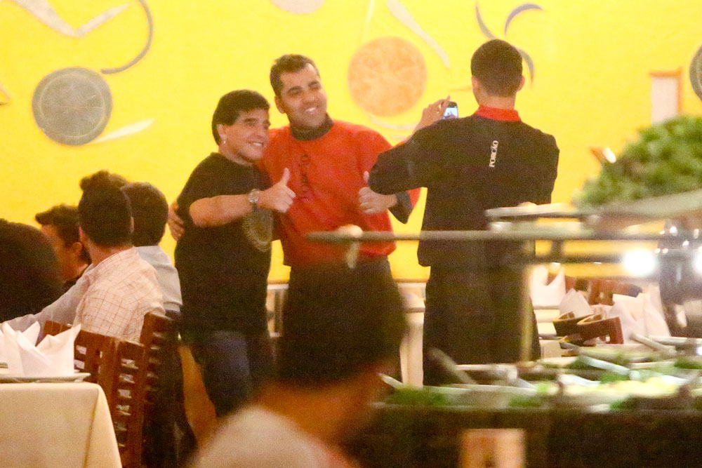 EXCLUSIVE: Legendary soccer star Diego Maradona enjoys dinner in Rio