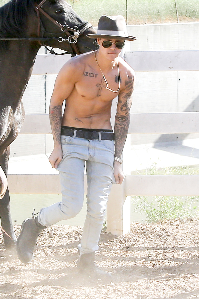 Justin Bieber takes a ride on a White Horse
