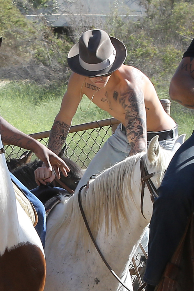 Justin Bieber takes a ride on a White Horse