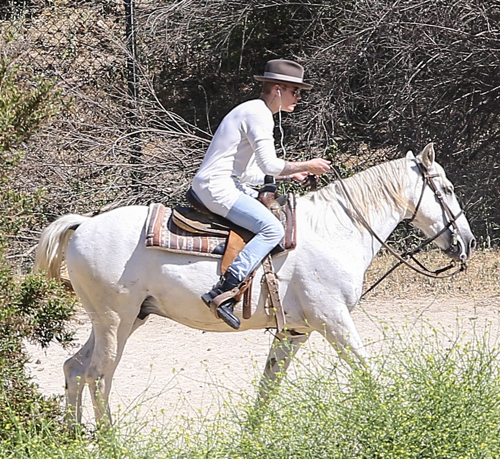 Justin Bieber takes a ride on a White Horse