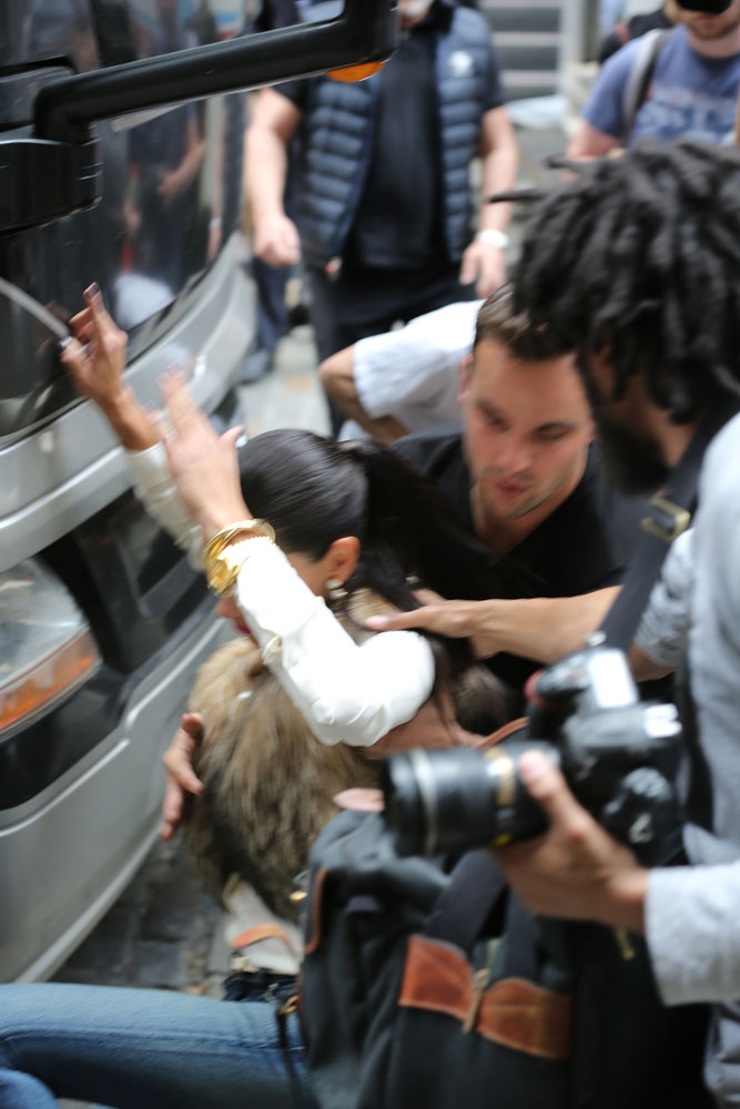 EXCLUSIVE: Adriana Lima bumps her head at a Maybelline photo shoot