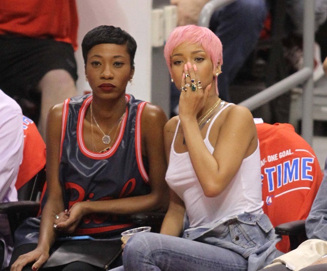 Rihanna shows her new hair color at the Clippers playoff game.