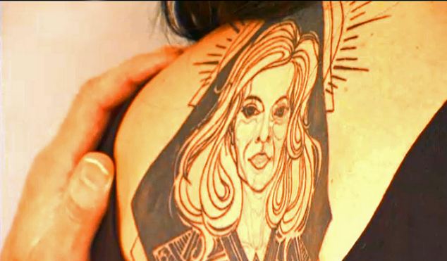 PIC SHOWS: Conchita Wurst shows her mother her tattoo.