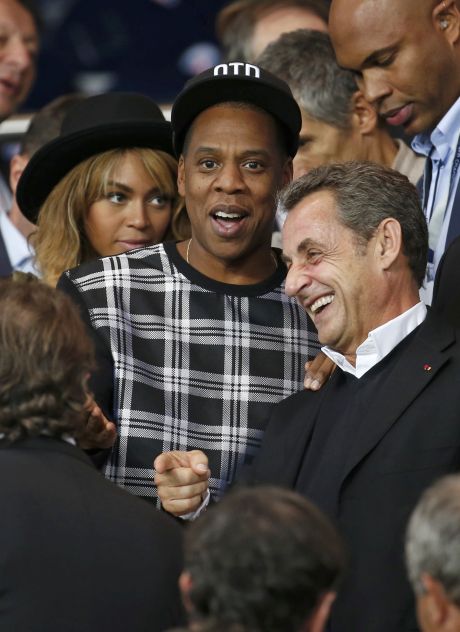 France's former president Sarkozy, recording artists Beyonce and her husband Jay-Z, arrive to attend the Champions League Group F soccer match opposing Paris St Germain and Barcelona at the Parc des Princes Stadium in Paris