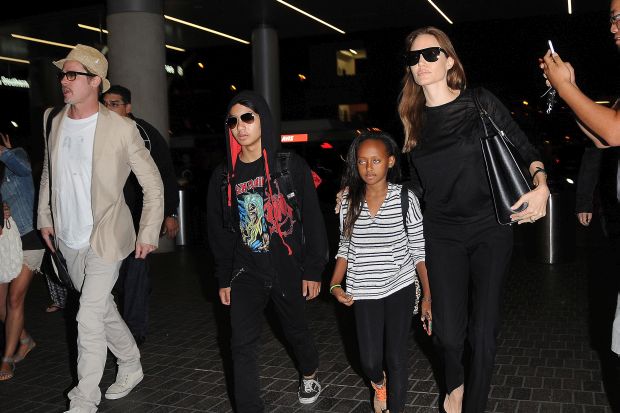 Angelina Jolie and Brad Pitt make their way through LAX with their kids
