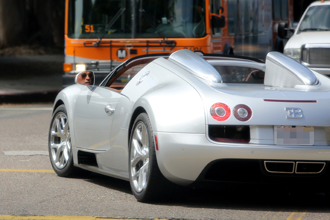 Arnold Schwarzenneger drives a $2.5 million dollar Bugatti in Los Angeles
