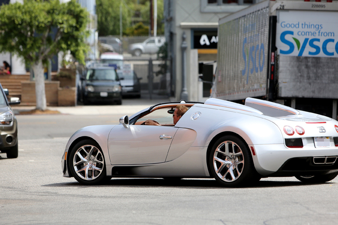 Arnold Schwarzenneger drives a $2.5 million dollar Bugatti in Los Angeles