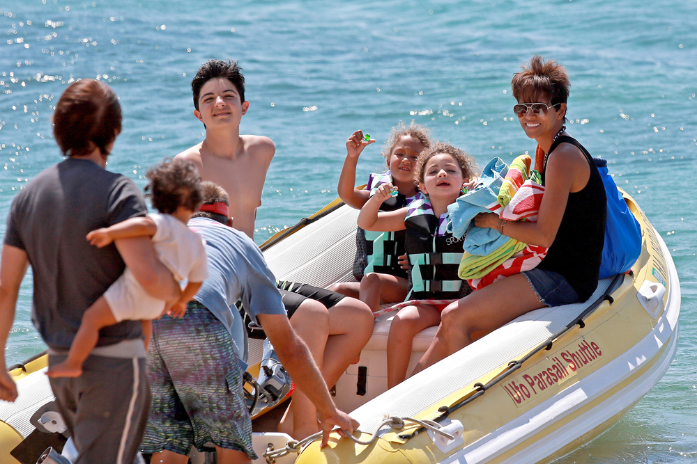 EXCLUSIVE: Ha lle Ber ry smiles ear to ear during her Hawaiian Family Vacation