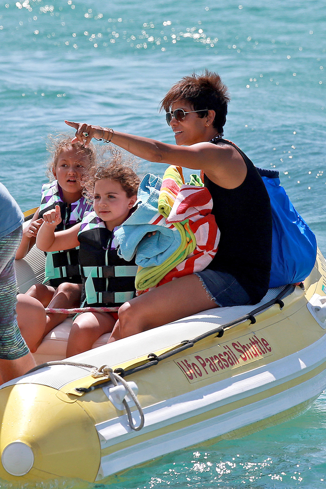 EXCLUSIVE: Ha lle Ber ry smiles ear to ear during her Hawaiian Family Vacation