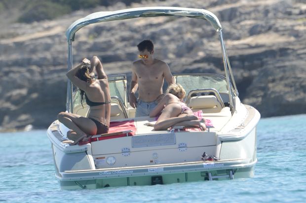 James Blunt with topless girlfriend on a boat in Formentera