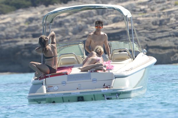 James Blunt with topless girlfriend on a boat in Formentera