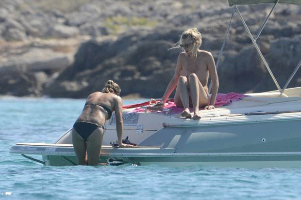 James Blunt with topless girlfriend on a boat in Formentera