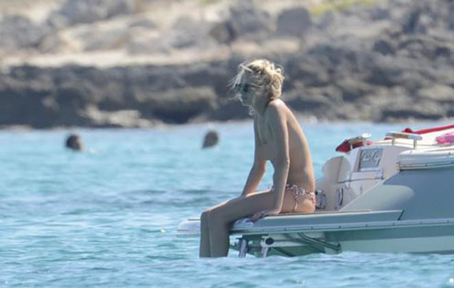 James Blunt with topless girlfriend on a boat in Formentera