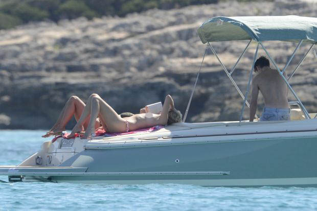 James Blunt with topless girlfriend on a boat in Formentera