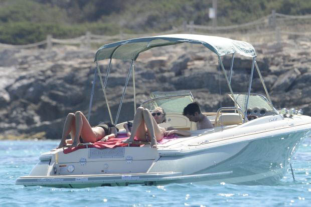 James Blunt with topless girlfriend on a boat in Formentera