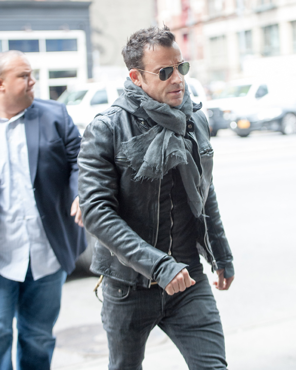 EXCLUSIVE: Justin Theroux arrives at his hotel wearing a leather jacket in New York City